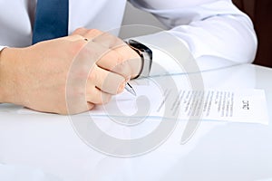 Businessman is signing a contract, business contract details