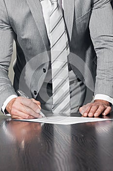 Businessman signing contract document