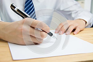 Businessman signing documents