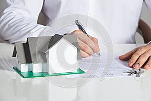 Businessman Signing House Contract