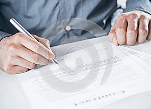 Businessman signing a legal document