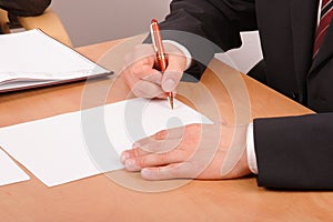 Businessman signing papers - 2