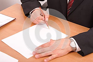 Businessman signing papers