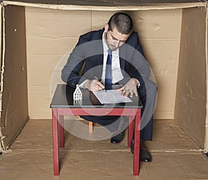 Businessman signs a contract insurance on the house