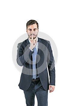 Businessman silent quiet gesture
