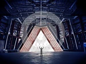 Businessman silhouette celebrating raising arms in his large Iron construction office hall