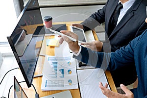 businessman sit at ther table looking at computer