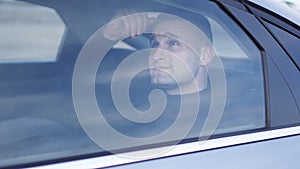 Businessman sitting in the back seat of the car