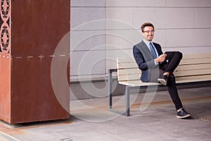 Businessman sitting on bench