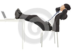 Businessman sitting on a chair to take a rest