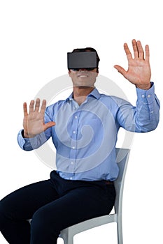 Businessman sitting chair while wearing vr glasses