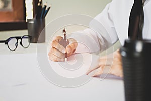 businessman sitting chair writing and signature on the paper document is working in his office