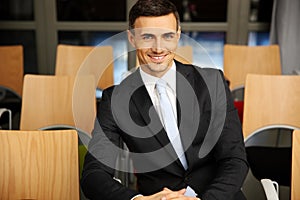 Businessman sitting at conference hall