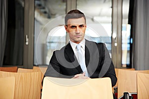 Businessman sitting at conference hall