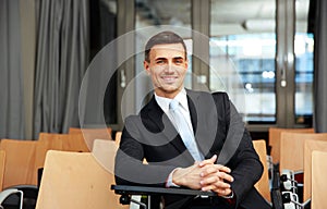 Businessman sitting at conference hall