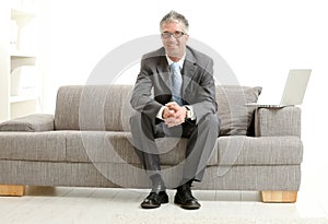 Businessman sitting on couch