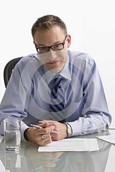 Businessman Sitting at Desk - Isolated