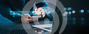 The businessman sitting at a desk in the workplace using a laptop. Search engine browsing of internet data information is the idea