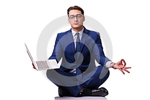 The businessman sitting on the floor isolated on white