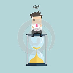 Businessman sitting on hourglass. deadline concept