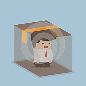 Businessman sitting inside the box