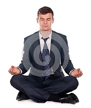 Businessman sitting in lotus position