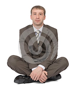 Businessman sitting in lotus posture