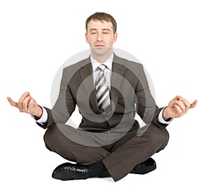Businessman sitting in lotus posture