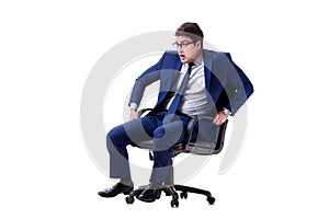 The businessman sitting on office chair isolated on white