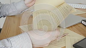 Businessman Sitting At Office Desk Signing a Contract