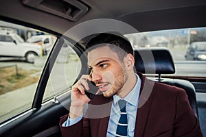 Businessman sitting in stretch limo