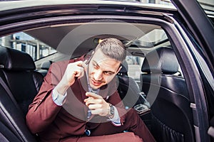 Businessman sitting in stretch limo