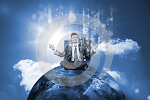 Businessman sitting on top of the world with data server