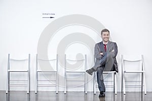 Businessman sitting and waiting for interview in office