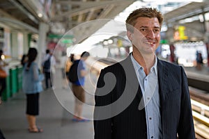 Businessman at the sky train station in Bangkok, Thailand