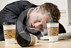 Businessman sleeping at desk