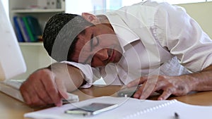 Businessman sleeping at his desk