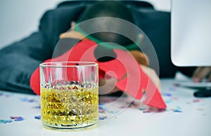 Businessman sleeping in his office after a christmas party