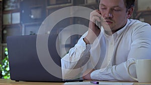 Businessman sleeping on laptop