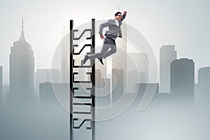 The businessman slipping from the top of ladder