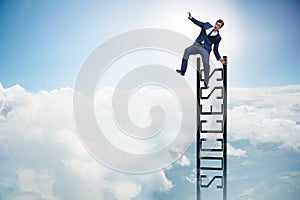 The businessman slipping from the top of ladder