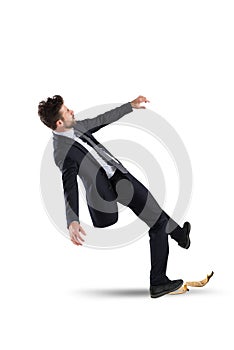 Businessman slips on a banana peel. concept of unlucky and failure