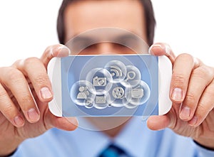 Businessman with smart gadget accessing cloud applications photo