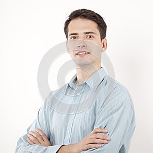 Businessman with smile looking at camera and crossing his arms