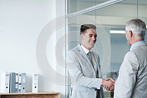Businessman, smile and shaking hands with CEO, manager and suit for deal or promotion. Man, consult and hand for