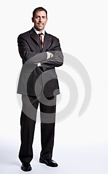 Businessman smiling with arms crossed