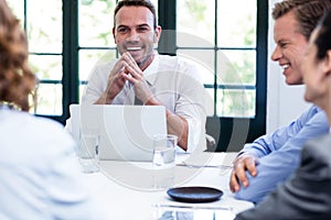 Businessman smiling in a business meeting