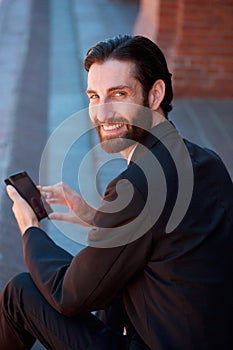 Businessman smiling with cell phone
