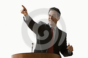 Businessman Smiling And Pointing - Isolated