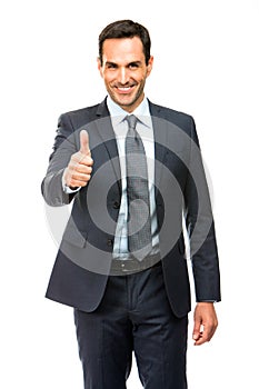 Businessman smiling thumb up photo